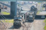 NS 9821 leads train 27N out of Enola yard past a switcher set